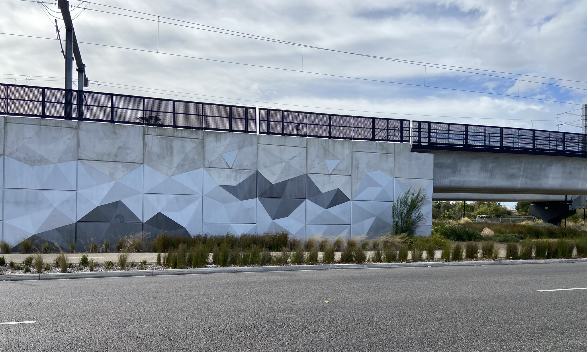 Metallic shades for Frankston’s sparkling rail bridge
